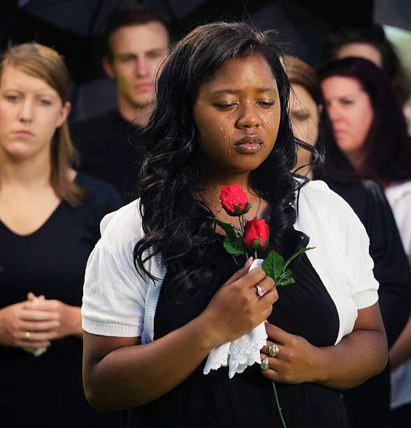 Georgia Final Expense Planning – Legacy of Love | Crook & Covenant Well-dressed woman holding a rose with tears on her face, symbolizing the emotional importance of final expense insurance in Georgia through Crook & Covenant.